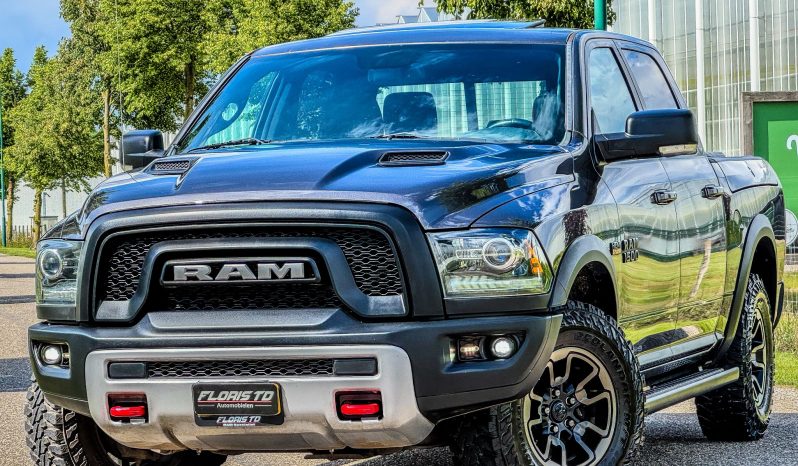 DODGE RAM 1500 5.7L HEMI 4X4 401PK V8 * REBEL * OFF – ROAD * RAMBOX * 2E EIGENAAR * NETTE CONDITIE * ZWARTE HEMEL * SCHUIFKANTELDAK * AFSTAND START * STOELVERWARMING * STUURVERWARMING * SIDE BARS * TOW HOOKS ROOD * 18 INCH OFF ROAD LICHTMETALEN SPORTVELGEN * vol